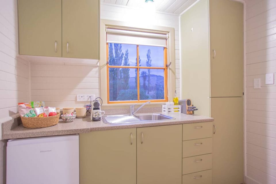 Small fridge, one single induction hob and a microwave for your easy meal prep.