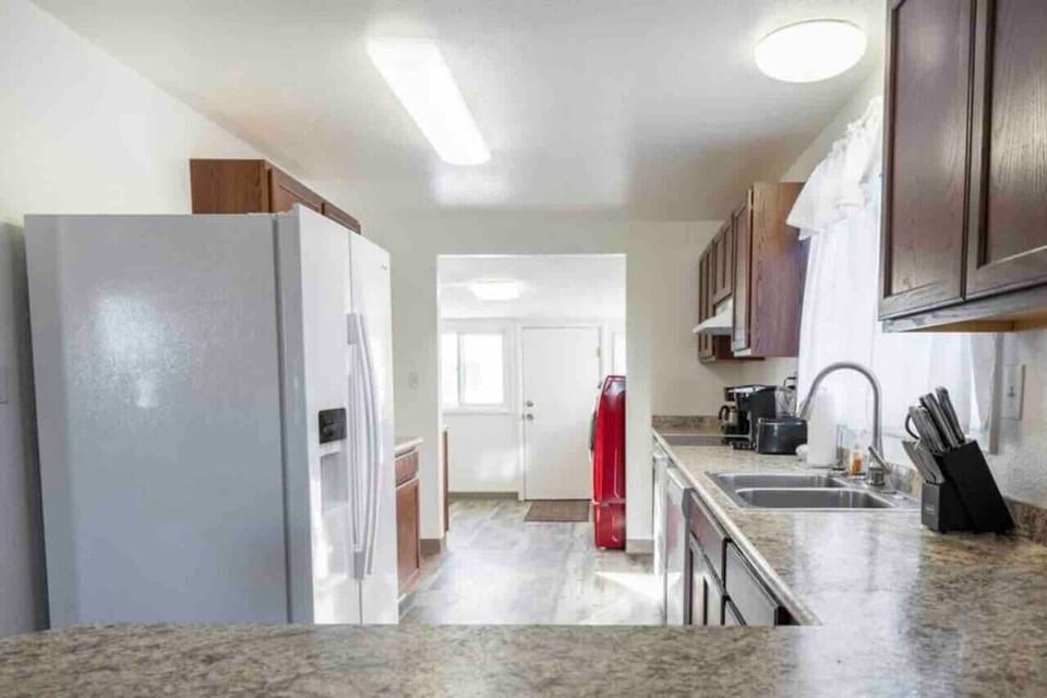 Open-concept living room view into the kitchen, view from the breakfast bar