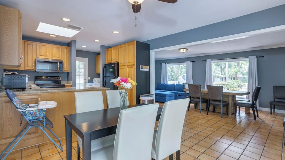 Perfect for feeding a crowd, this open kitchen and dining space keeps everyone connected throughout the day.
