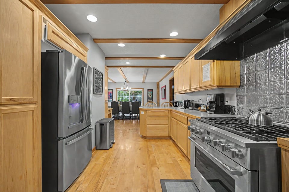 Whip up culinary delights in the modern kitchen, with stainless steel appliances and a functional layout.