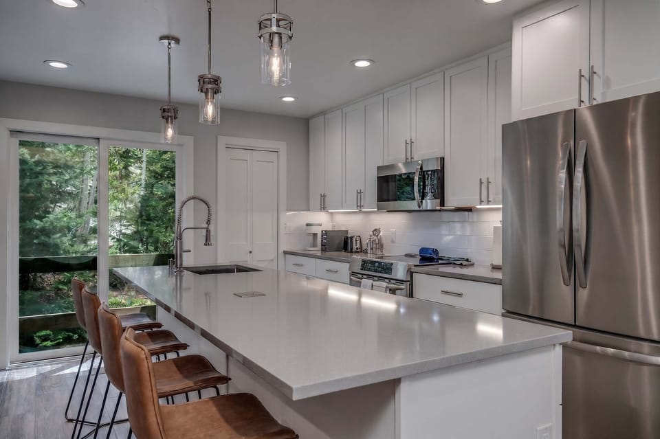 Prepare meals at home with ease in the fully equipped kitchen where you’ll find everything from like-new appliances to an air fryer and blender.
