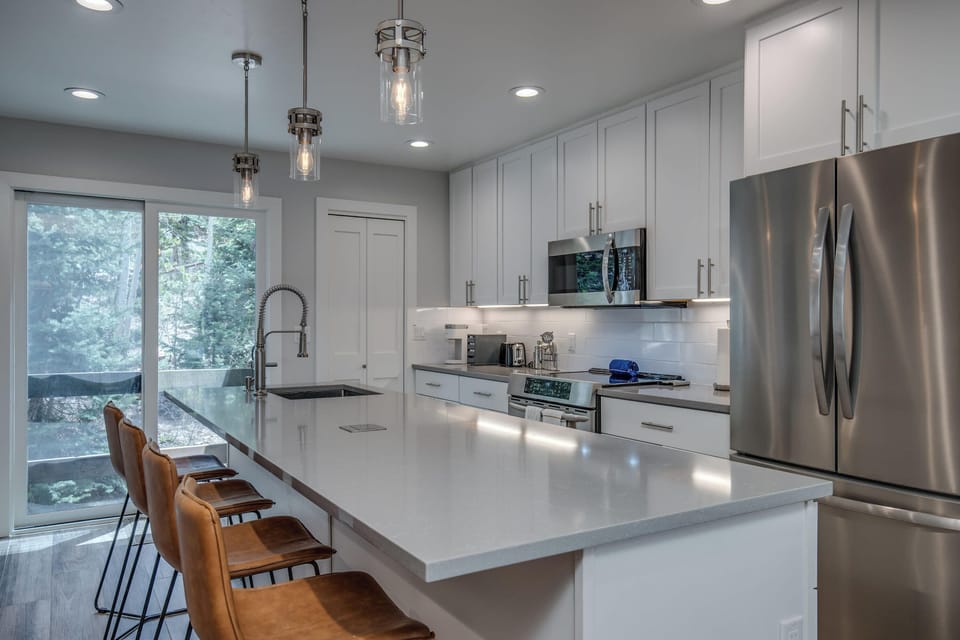 Prepare meals at home with ease in the fully equipped kitchen where you’ll find everything from like-new appliances to an air fryer and blender.