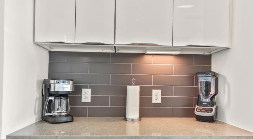 Stainless steel appliances, ample counter space, and a coffee machine for your convenience.