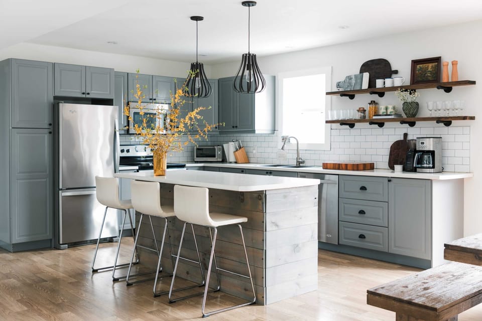 The kitchen is off the dining area + steps from the beautiful backyard oasis.
