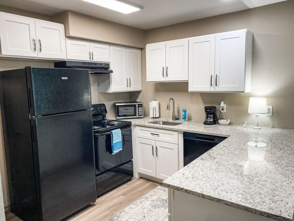 Feel at home in a well-stocked kitchen, dishwasher, cooking essentials, and plenty of counter space to enjoy daily meals.