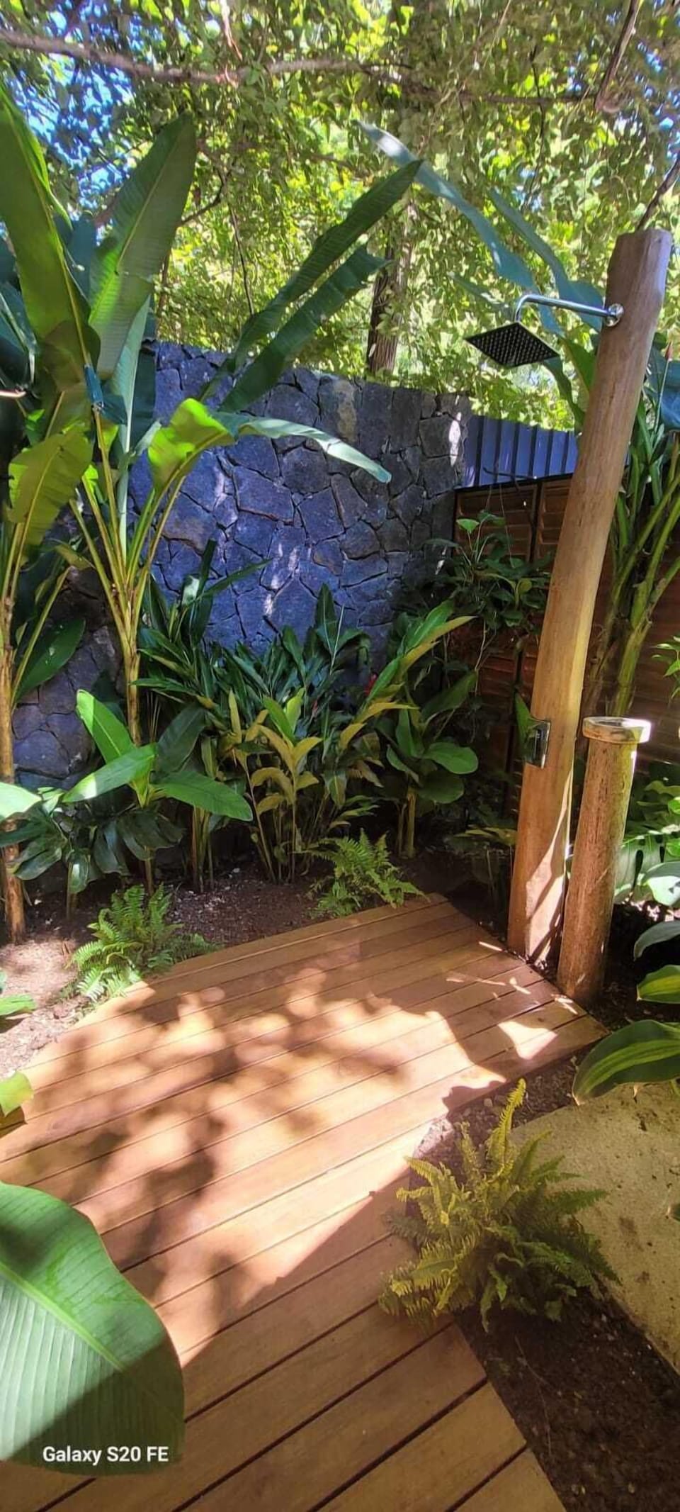 Nice outdoor shower to enjoy the tropical grounds by the master bedroom.