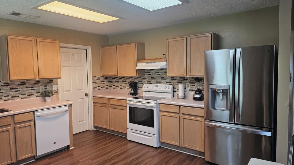Discover the joy of cooking in our modern kitchen, designed for convenience and comfort.