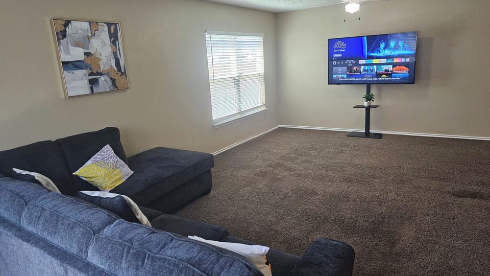 Unwind in our cozy living room, perfect for relaxing movie nights and entertainment.