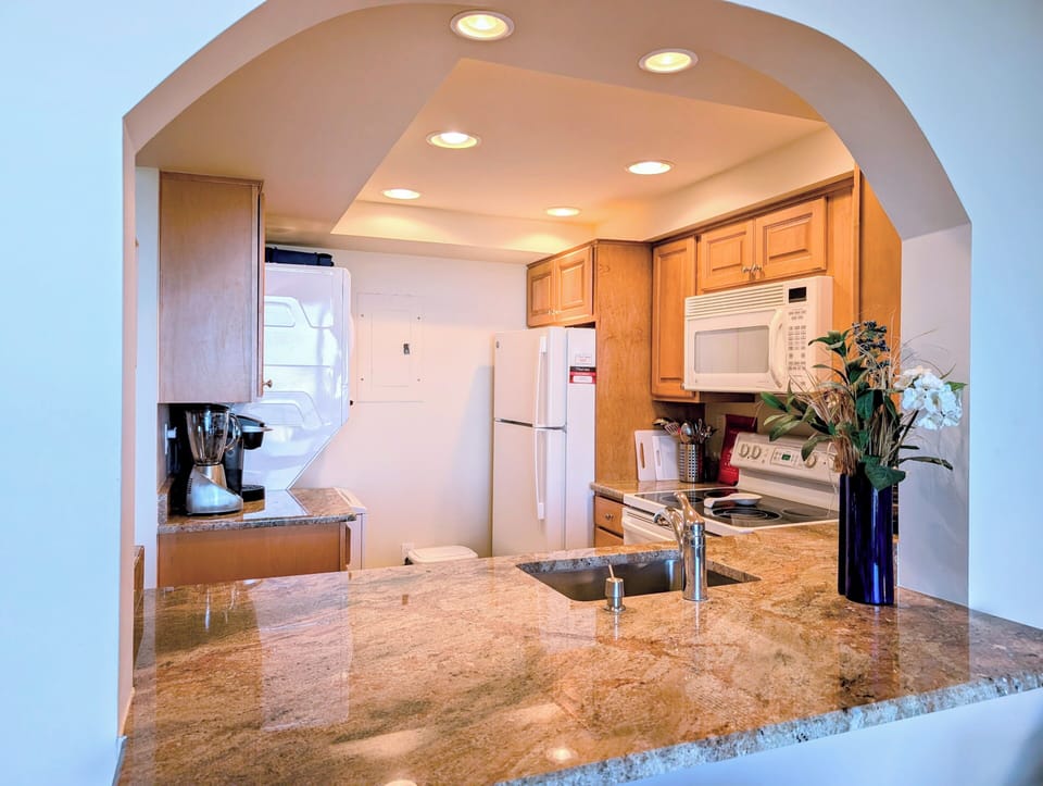 608 Dover Sea Colony East Modern Kitchen - Chef’s kitchen at 608 Dover, Sea Colony East, featuring a spacious breakfast bar and custom cabinetry.