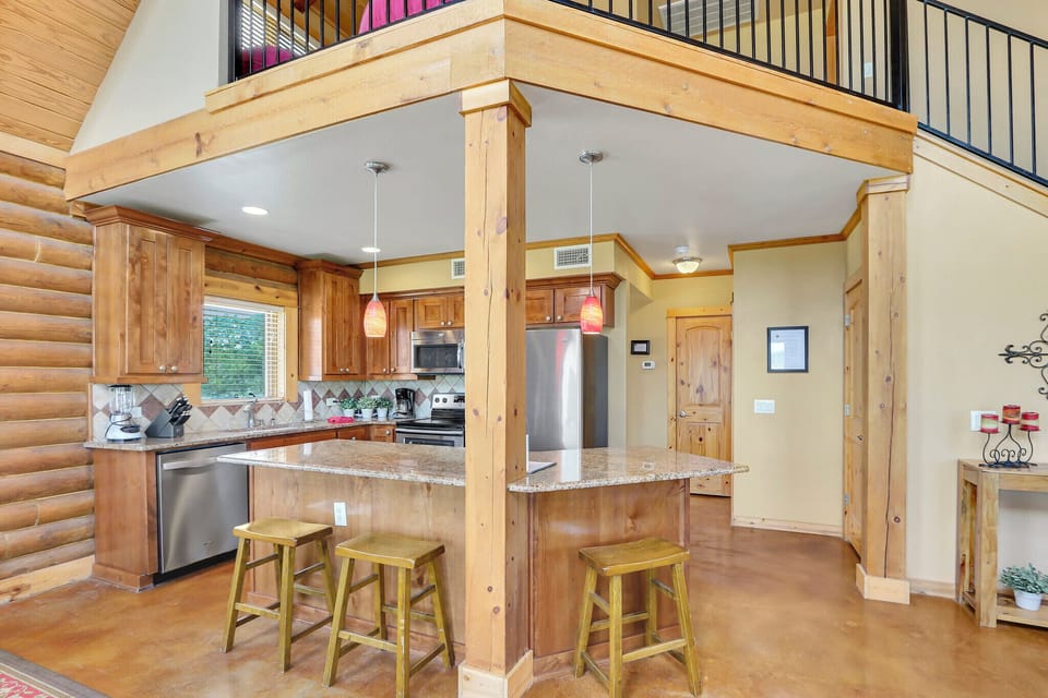 Above the kitchen is a bonus loft
