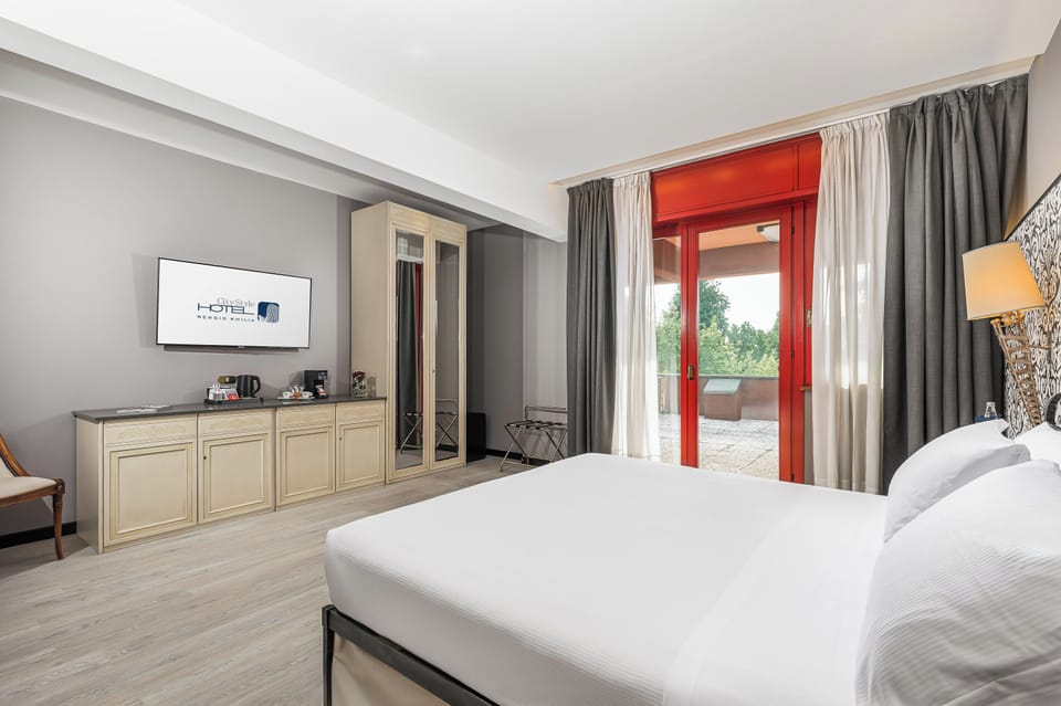 Deluxe Room, City View | Premium bedding, down comforters, memory foam beds, minibar