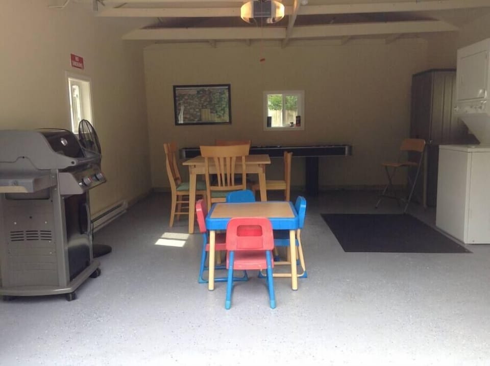 Garage provides Shuffle Board, board games,  playing cards,  and poker chips. Expandable table to accommodate  6 people.      