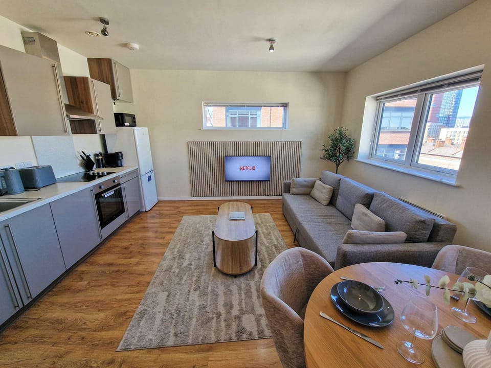 Gather together on the plush sofa, plenty of room for everyone to spread out and relax