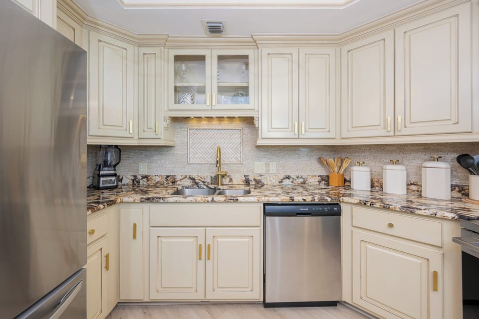 Cook and gather in this elegant kitchen with a stylish backsplash and warm tones