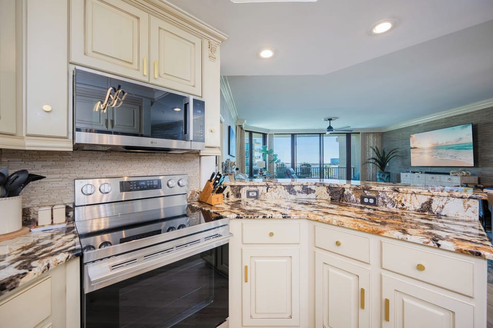 Upgrade your culinary experience in this stylish kitchen with modern stainless appliances and elegant design