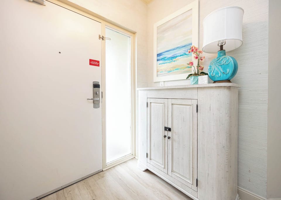 Step into a warm welcome, where coastal decor and soft lighting set the mood for your coastal retreat