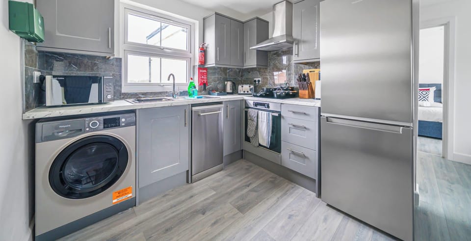 FULLY EQUIPPED KITCHEN WITH SLEEK APPLIANCES