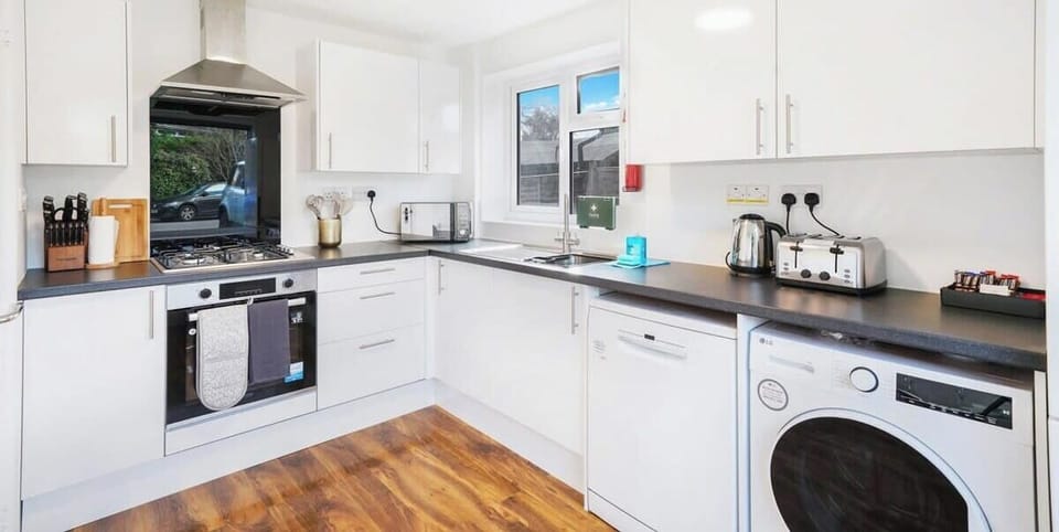FULLY EQUIPPED KITCHEN AND WASHER