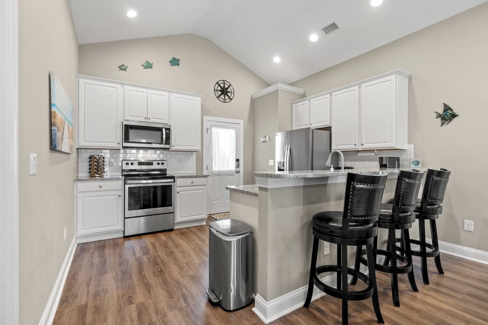 The kitchen counter provides additional  space for serving snacks or meals