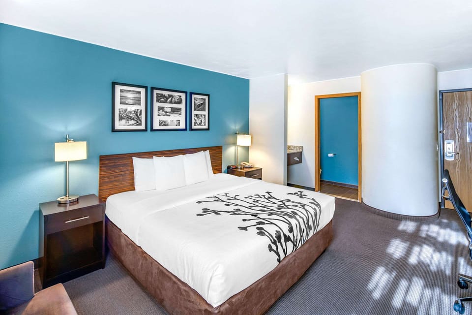 Premium bedding, desk, laptop workspace, iron/ironing board