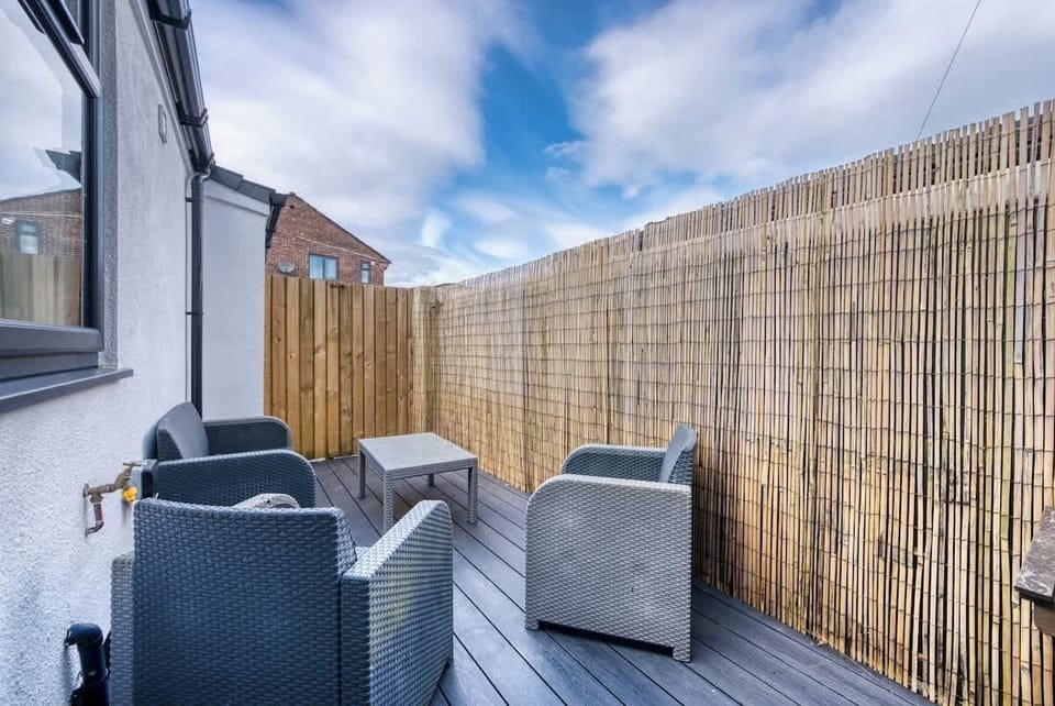 Charming outdoor patio, perfect for a peaceful morning coffee or an afternoon tea with family, at Blue Puffin Stays Short Lets & Serviced Accommodation.