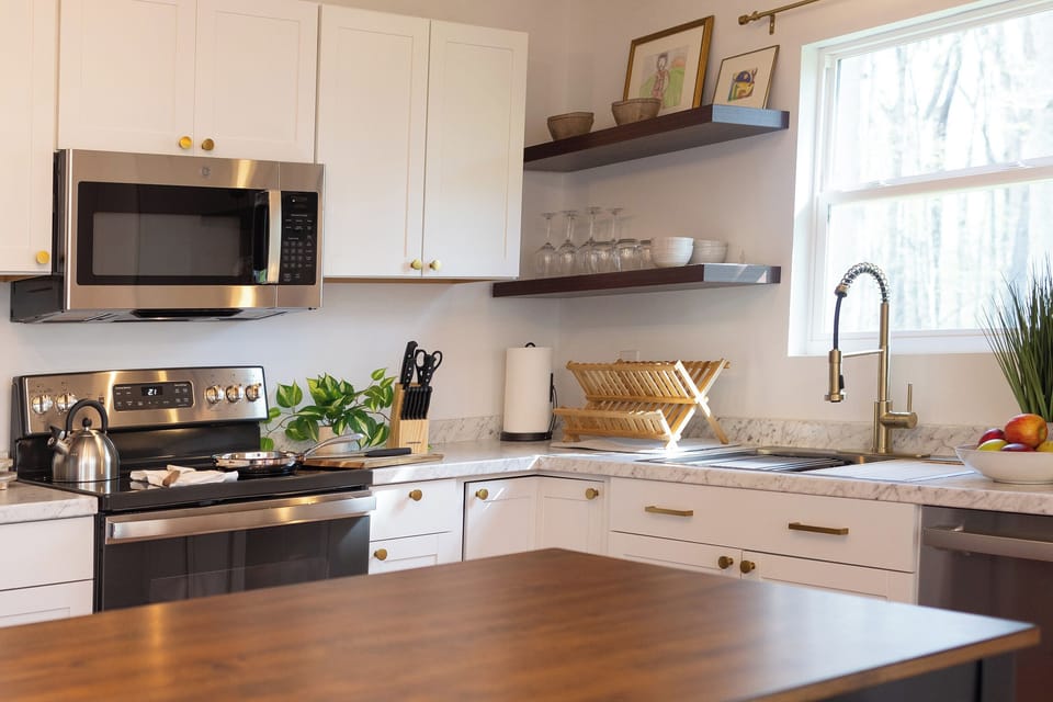 Full size fridge, stove, oven, microwave, and dishwasher.