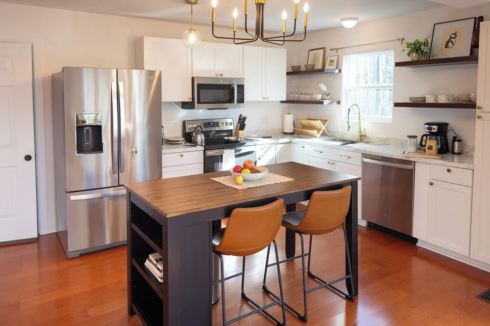 Kitchen is fully stocked with dishes, bakeware, pots, pans, wine glasses...