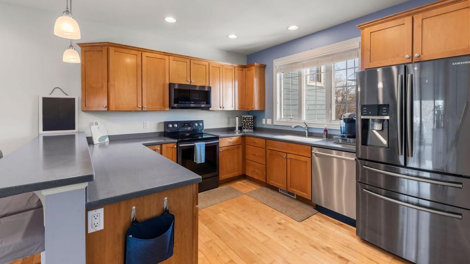 Spacious kitchen with modern appliances and natural light