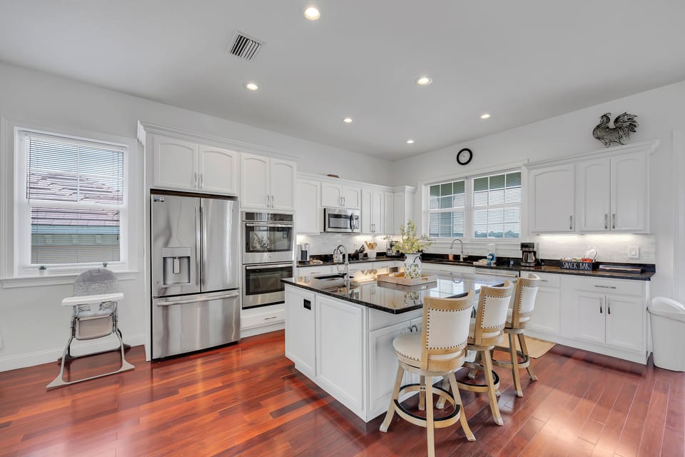 This kitchen is stacked to the 9s with an industrial oven and more. 