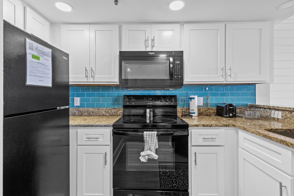 Full kitchen with granite countertops