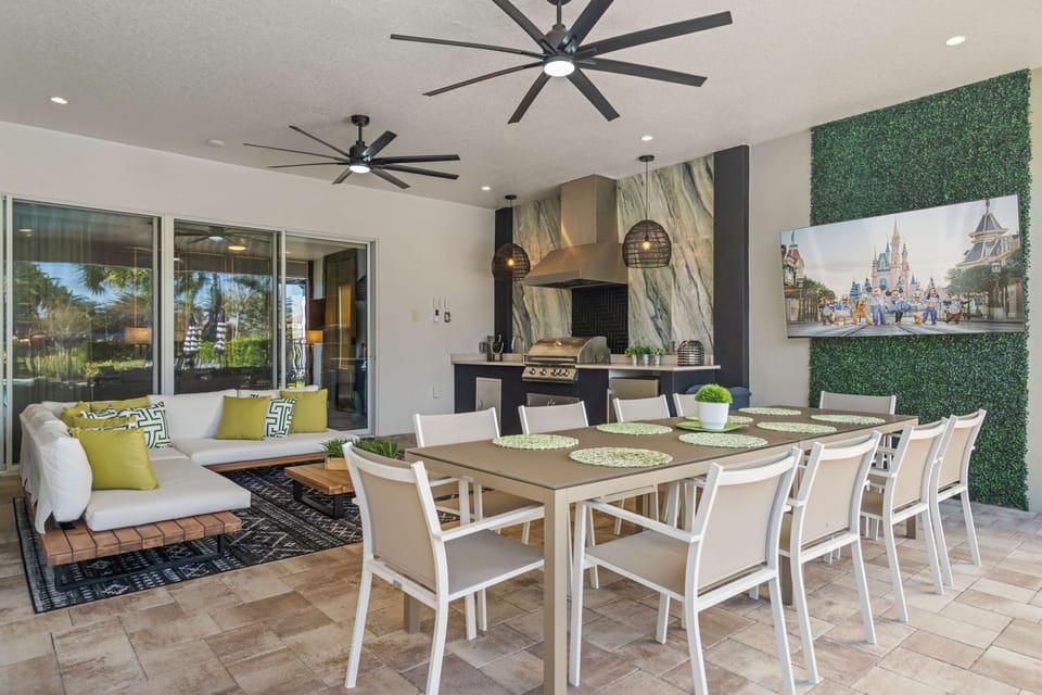 Dine al fresco under the covered lanai. The pool safety fence provides an added layer of protection