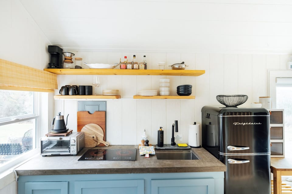 Thoughtfully stocked kitchenette with everything needed for cozy tiny living.