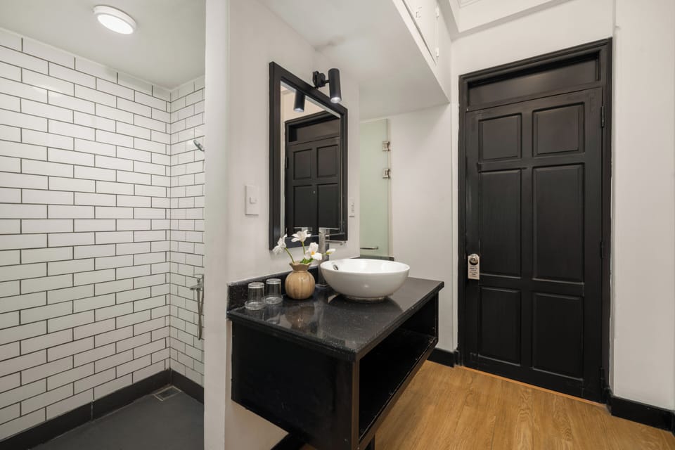 Shower, designer toiletries, hair dryer, slippers