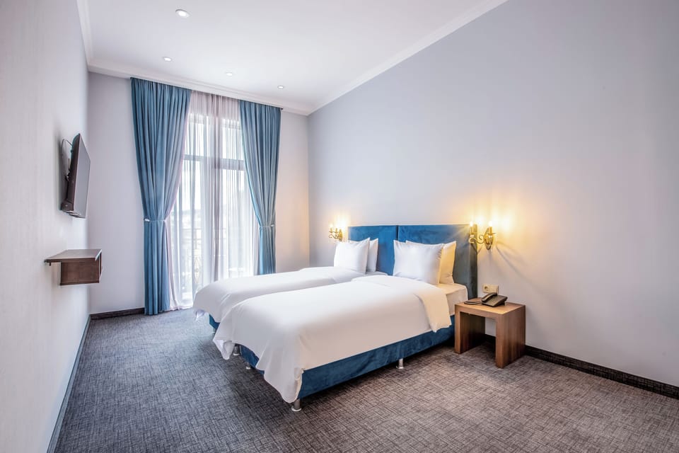 Standard Room - Street View | In-room safe, soundproofing, iron/ironing board, free cribs/infant beds