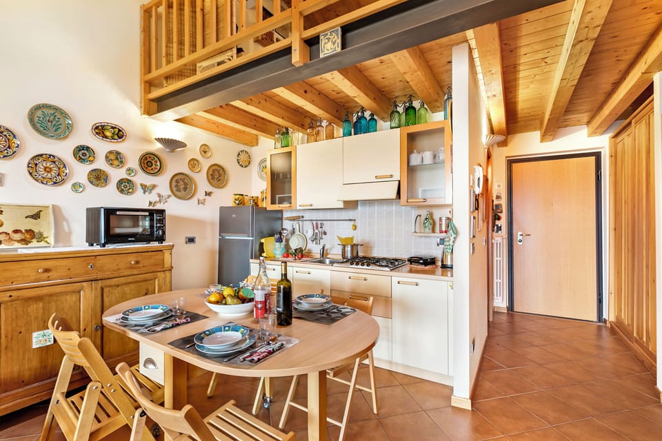 Standard Apartment, Multiple Bedrooms (Grotten Loft with lake view & pool) | Private kitchen | Fridge, microwave, stovetop, coffee/tea maker