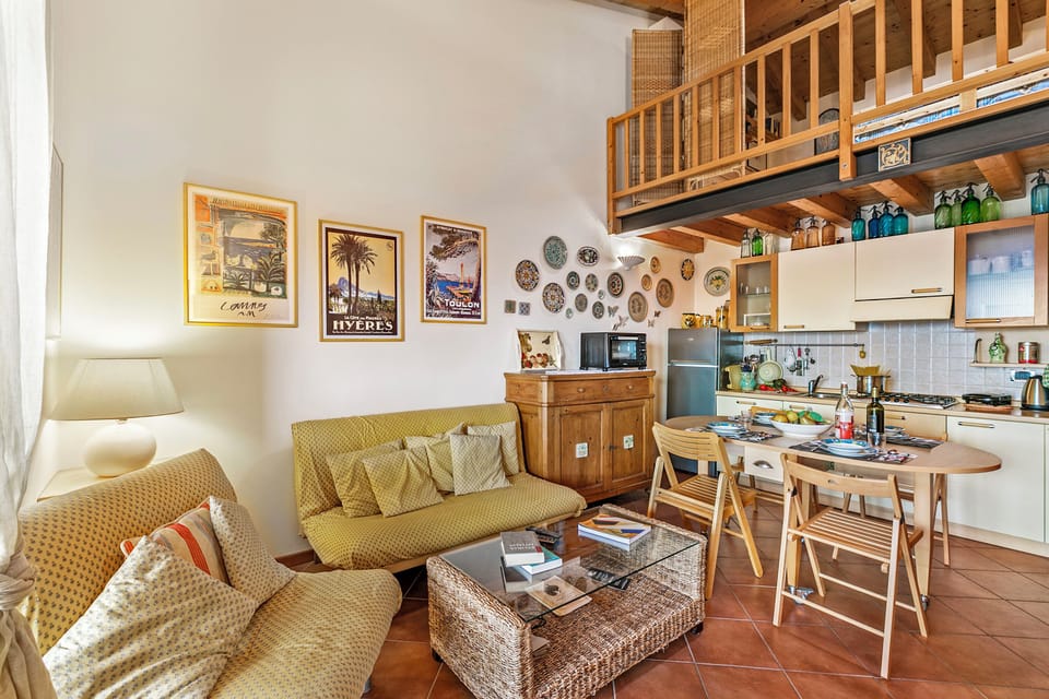 Standard Apartment, Multiple Bedrooms (Grotten Loft with lake view & pool) | Living area | 21-inch Smart TV with cable channels