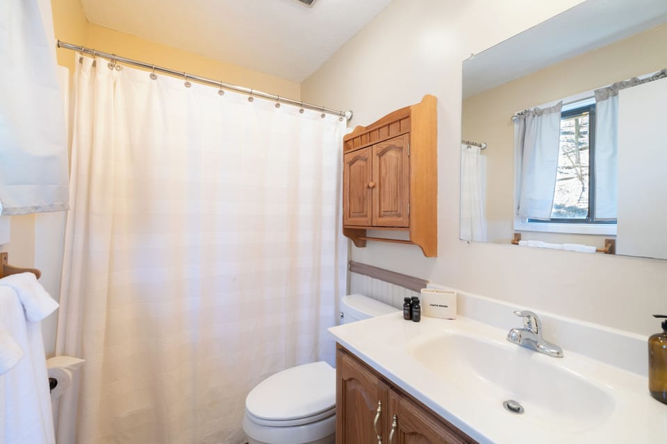 The primary bedroom's ensuite bathroom offers a shower/tub combo.