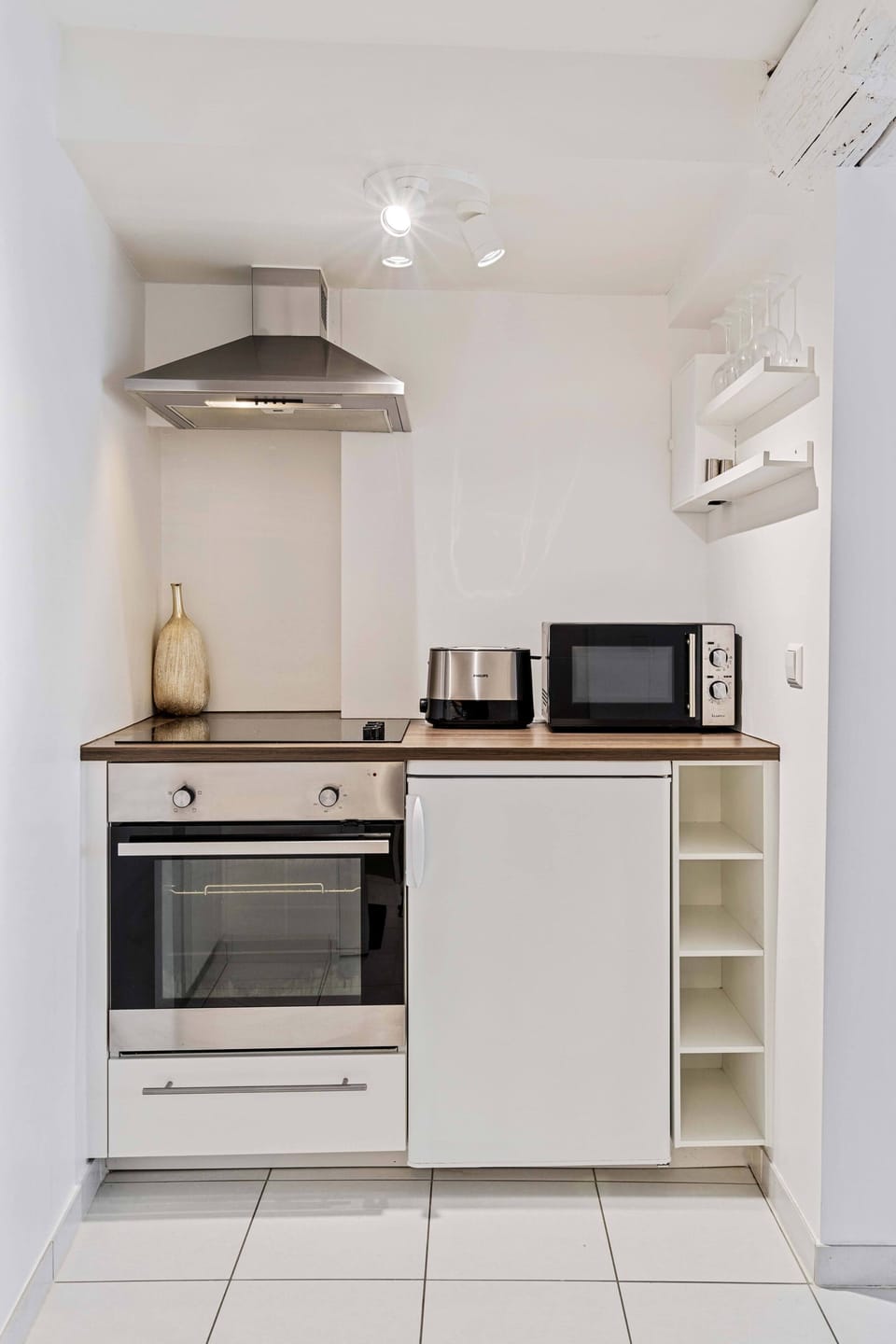 Fully equipped kitchenette with essential appliances, perfect for preparing meals during your stay.