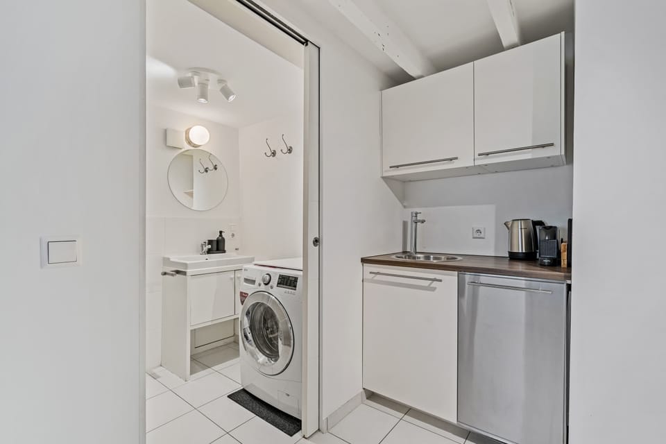 Convenient laundry facilities and a compact kitchen area to make you feel at home.