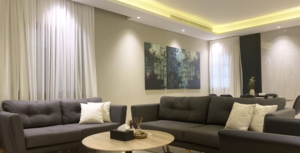 Design Apartment, 3 Bedrooms | Living area | Flat-screen TV