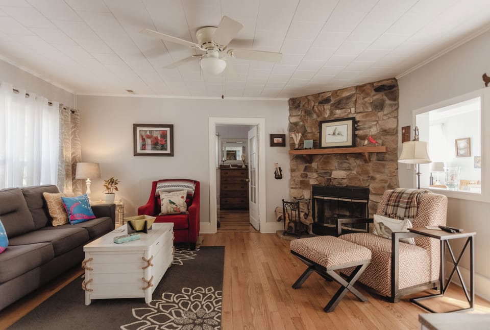 Enjoy the living room with a large flat screen TV and fireplace