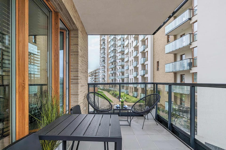 The balcony provides a perfect spot for enjoying the fresh air. 