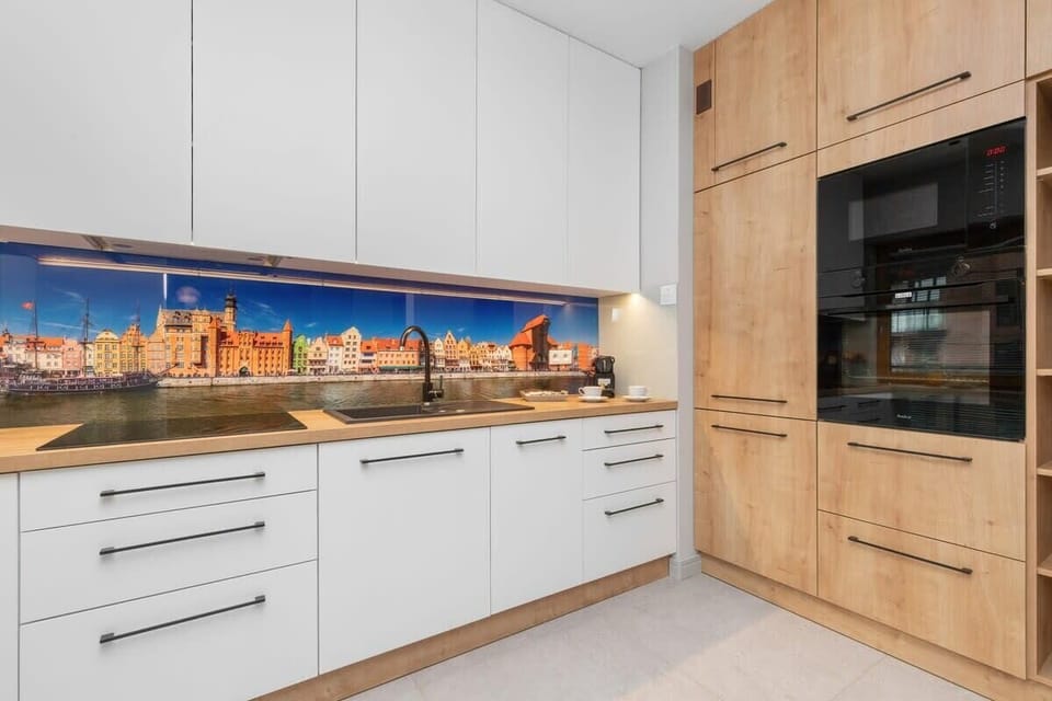 The sleek design of the kitchenette blending seamlessly with the living area.