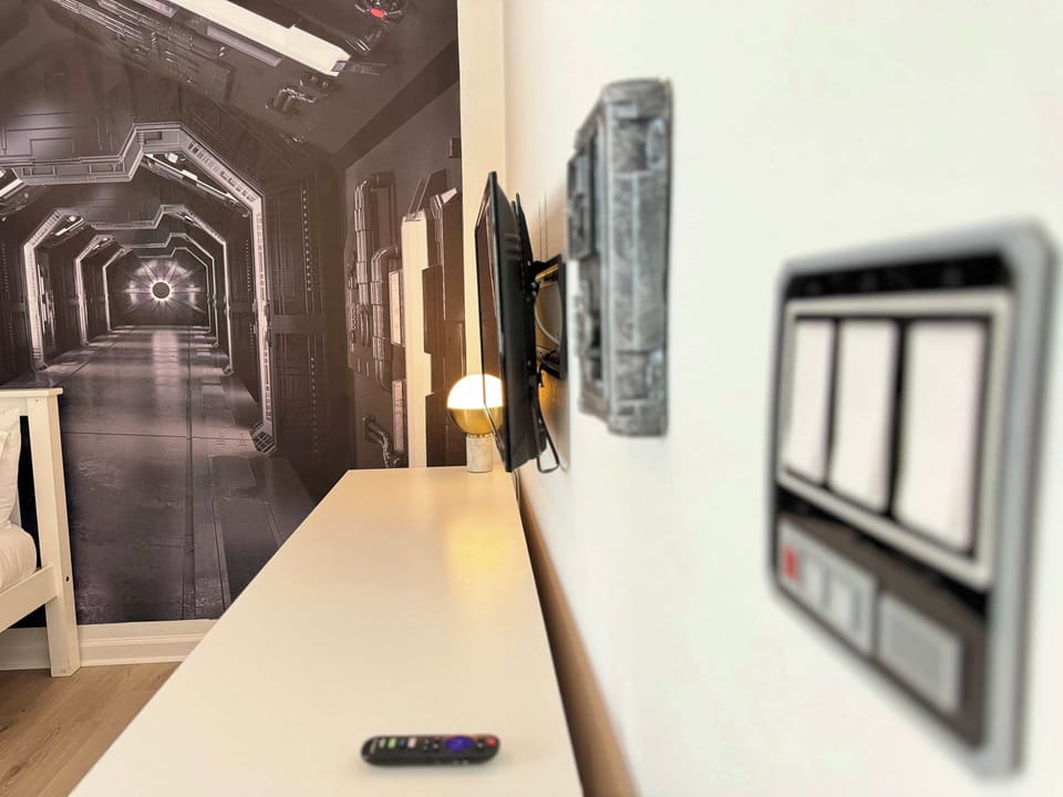 Jedi Chambers Room: Step into a galaxy far, far away with detailed Star Wars decor and a dedicated TV