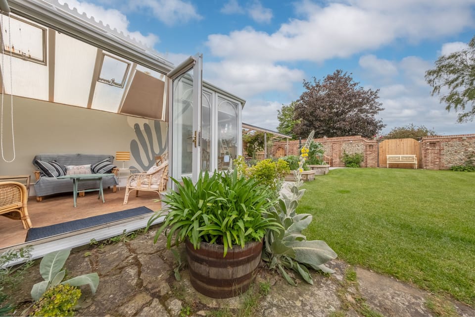 Ground floor:  Conservatory with doors to enclosed garden