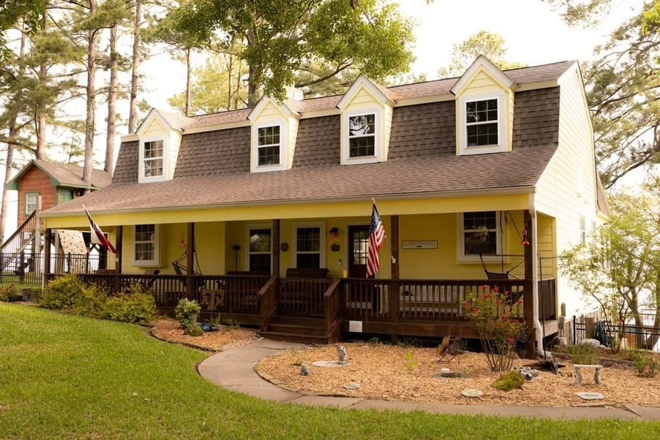 Spacious front porch with rocking chairs.  Great porch therapy !!