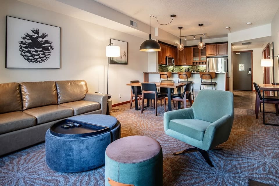 Spacious living area and dining table with seating for 4.