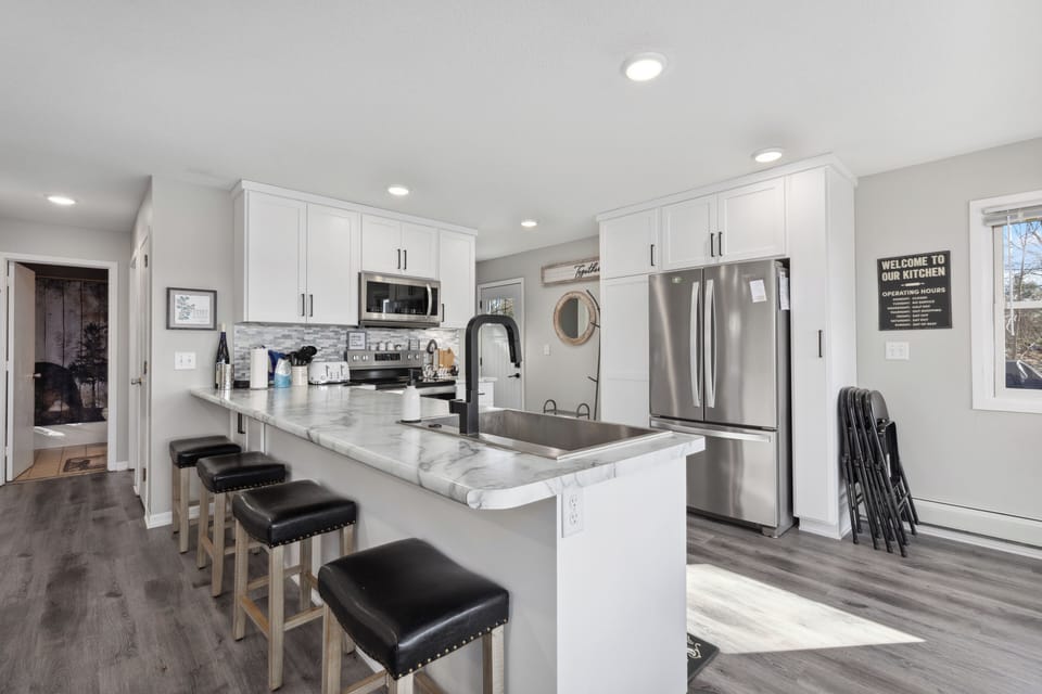 The breakfast bar includes four stools.