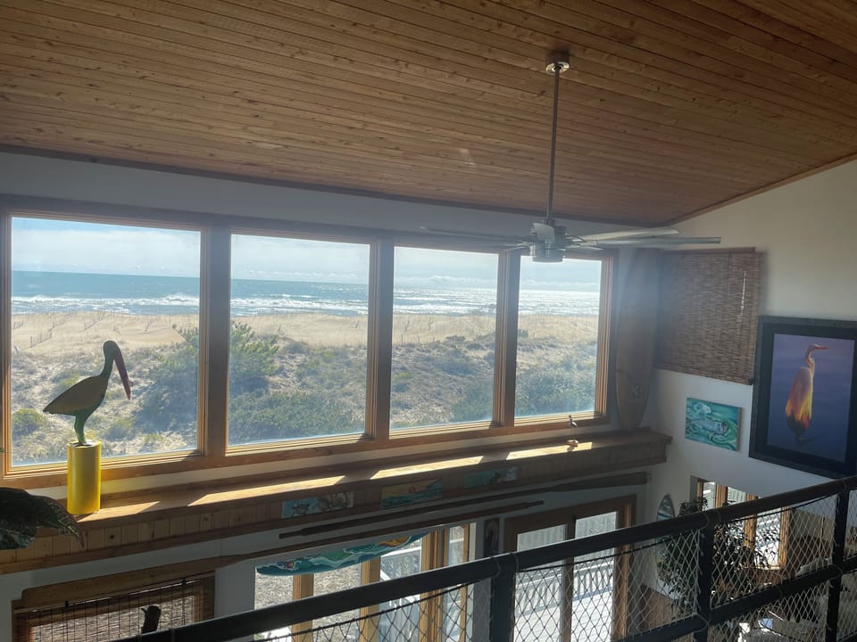 2nd level view- large panoramic windows, comfy chairs