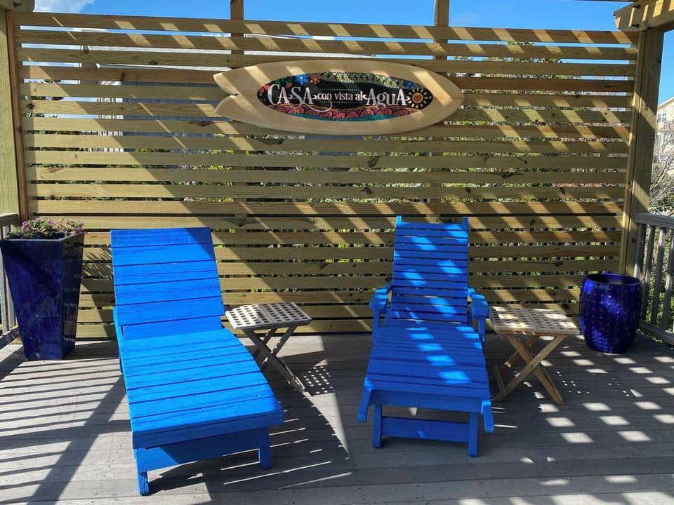 Oceanfront Gazebo with BBQ, lounge chairs and dining table.